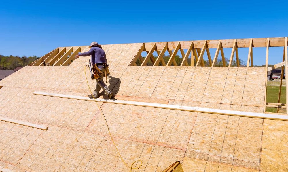 home-roof-construction-applying-roof-plywood-panels-in-new-house.jpg